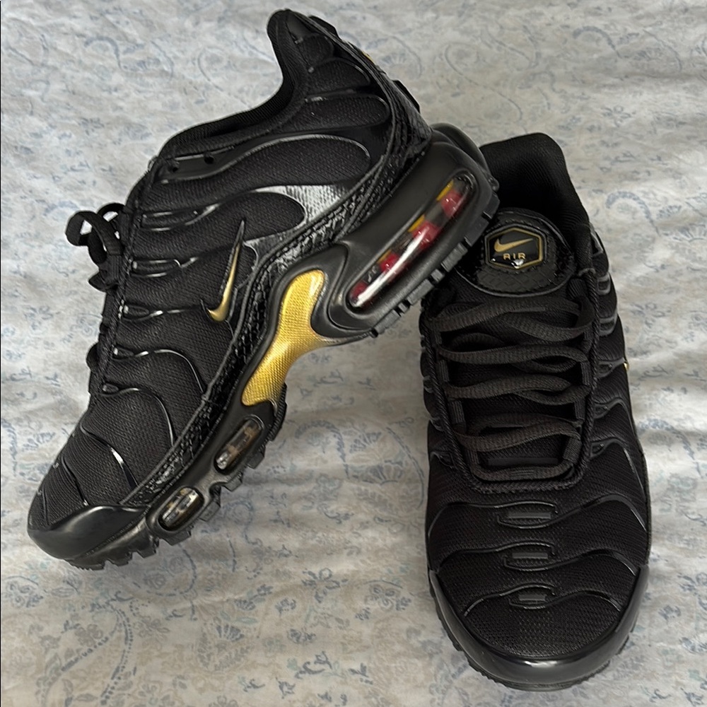 *SOLD* Nike Kid’s Black and Gold Sneakers